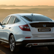 A photo of a white Honda Crosstour at sunset.